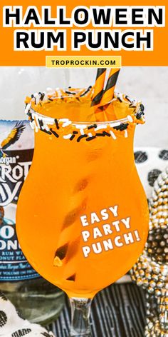 an orange halloween rum punch in a glass with the words easy party punch on it