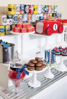 an assortment of desserts are displayed on a shelf in front of other foods and drinks