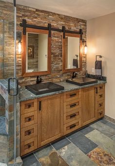 a bathroom with two sinks and mirrors in it