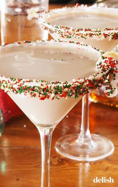 two martinis with sprinkles sit on a table