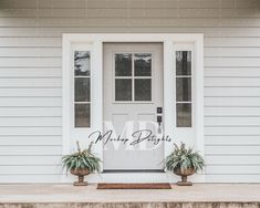 two potted plants sit on the front step of a white house, which is decorated with mr and mrs letters