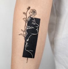 a woman's arm with a rose tattoo on the left side of her body