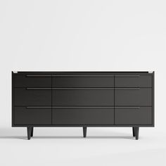 a black dresser sitting on top of a white floor