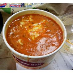 a bowl of soup sitting on top of a table