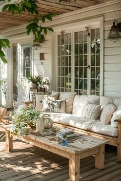 a couch and table on a wooden porch