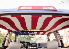 the interior of a car with an american flag painted on it's roof and sunroof