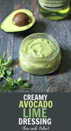 creamy avocado lime dressing in a jar with an avocado on the side