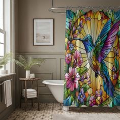 a colorful shower curtain with a bird and flowers on it in front of a bathtub