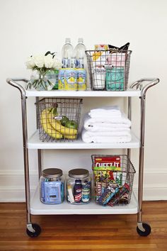 a shelf filled with lots of different types of food and drinks on top of it