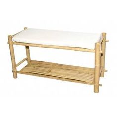 a bamboo shelf with a white cushion on top