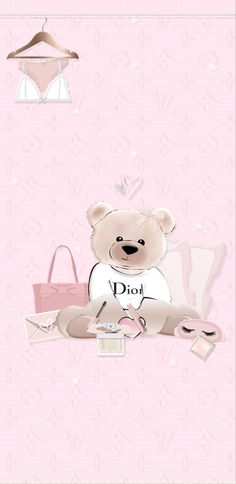 a teddy bear sitting on top of a pink wall