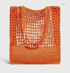 an orange handbag on a white background