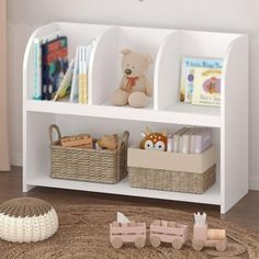 a white book shelf with baskets and toys