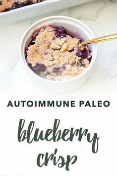 blueberry crisp in a white bowl with text overlay that reads, autoimmune paleo blueberry crisp