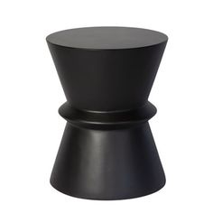 a black stool with an unusual design on the top and bottom, sitting in front of a white background