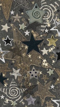 many different stars and swirls on a black background with gold, silver, and white colors