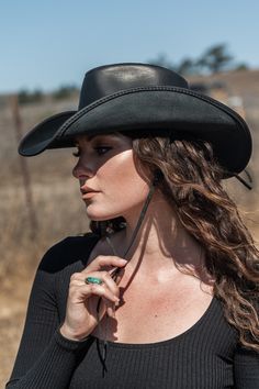 This womens leather cowboy hat is the perfect pairing of form and function. Built using durable, finished, 100% leather, it's built to last and protect you from the sun and rain on any adventure. Yet with its curved brim, and all-leather braided band, it's one of our best-looking hats. Adjustable Leather Hat Bands For Outdoor, Adjustable Leather Hats For Ranch, Country Style Hat With Leather Sweatband For Country Events, Country Style Hat Bands For Western-themed Events, Brimmed Leather Hats For Rodeo, Leather Brimmed Hat For Rodeo, Western Hat With Leather Sweatband For Western-themed Events, Leather Brimmed Rodeo Hat, Western Leather Hat With Leather Sweatband