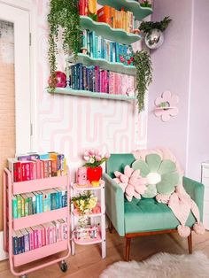 a living room filled with furniture and bookshelves next to a wall mounted book shelf