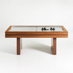 a wooden table with a glass top on it