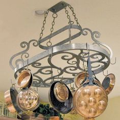 a chandelier with pots and pans hanging from it