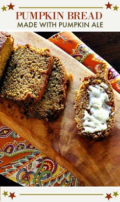 sliced pumpkin bread on a cutting board with whipped cream in the middle and two slices cut out