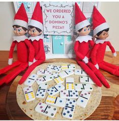 the elfs are playing domino game on the table