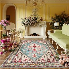 a living room filled with furniture and flowers