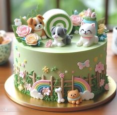 there is a cake decorated with animals and flowers