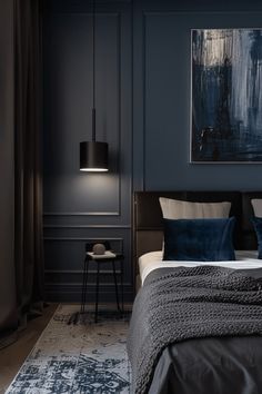 a bedroom with dark blue walls and white bedding