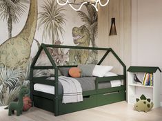 a child's bedroom with dinosaur themed wallpaper and green bed frame for the toddler