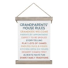 a sign hanging on the wall that says grandparents's house rules