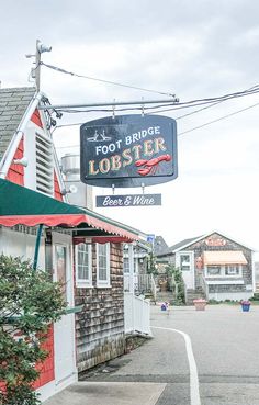 the foot bridge lobster restaurant is located on the corner of an empty street with houses in the background