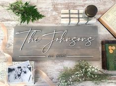 a wooden sign that says the jacksons on it next to other items and flowers