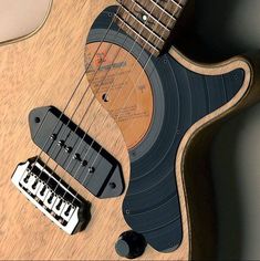 an electric guitar sitting on top of a table