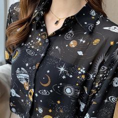 Step into a cosmic dream with this galaxy-themed chiffon shirt. Featuring prints of stars and planets on semi-transparent fabric, it’s ideal for adding a touch of the universe to your office or casual attire. The classic collar and button fastening give it a polished finish. Classic collar Print: galaxy, stars, planets, universe Button fastening Long sleeve Semi transparent fabric Cotton, acetate Planet Sky, Button Up Women, Preppy Aesthetic Outfits, Astrology Shirt, Sky Pattern, Printed Chiffon Blouse, Shirt Y2k, Y2k Clothing, Trendy Clothes