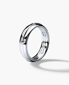 a white gold ring with diamonds on it