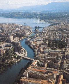 an aerial view of a river running through a city