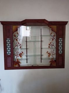 a decorative glass display case on the wall