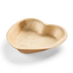 a wooden heart shaped dish on a white background