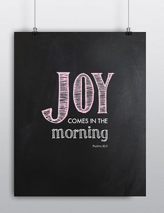 a chalkboard with the words joy comes in the morning