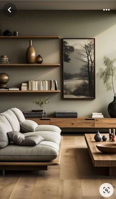 a living room with two couches and a coffee table in front of the wall