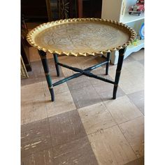 an ornately decorated tray sits on a table in the middle of a living room