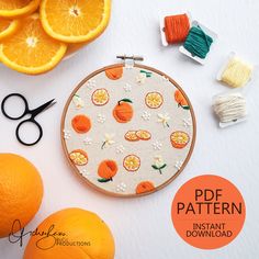 an orange pattern is on the hoop next to some fruit