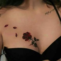 a close up of a woman's chest with roses on it and the words love written in cursive writing