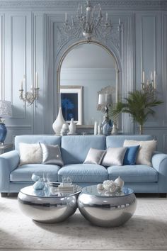 a living room with blue couches and chandelier