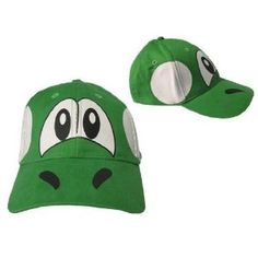 a green hat with an angry face on the front, and two eyes on the back