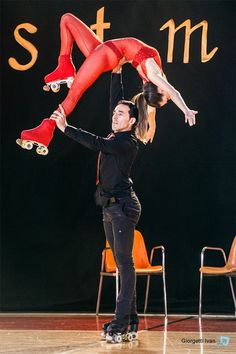 a man and woman doing tricks on skateboards