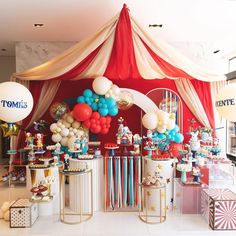 a party with balloons, cake and decorations