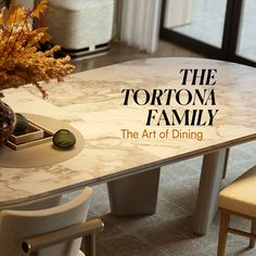 a marble dining table with chairs around it and the words, the tortona family