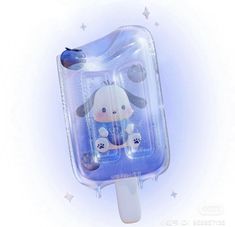 an ice lolly popsicle with a cartoon dog on it's side and stars in the background